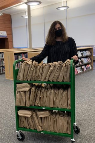 Mrs. Farmer getting ready for Date with a Book display