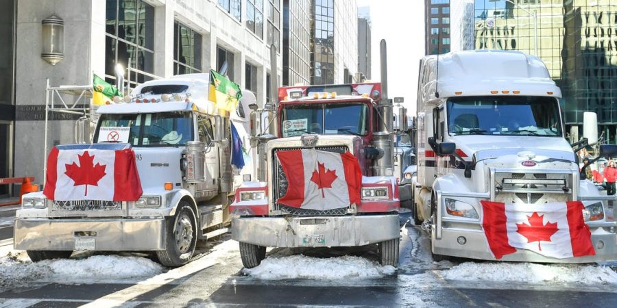 Truckers+lineup+their+trucks+on+Metcalfe+Street+as+they+honk+their+horns+on+February+5%2C+2022+in+Ottawa%2C+Canada.%28Panagiotakis%2FGetty+Images%29