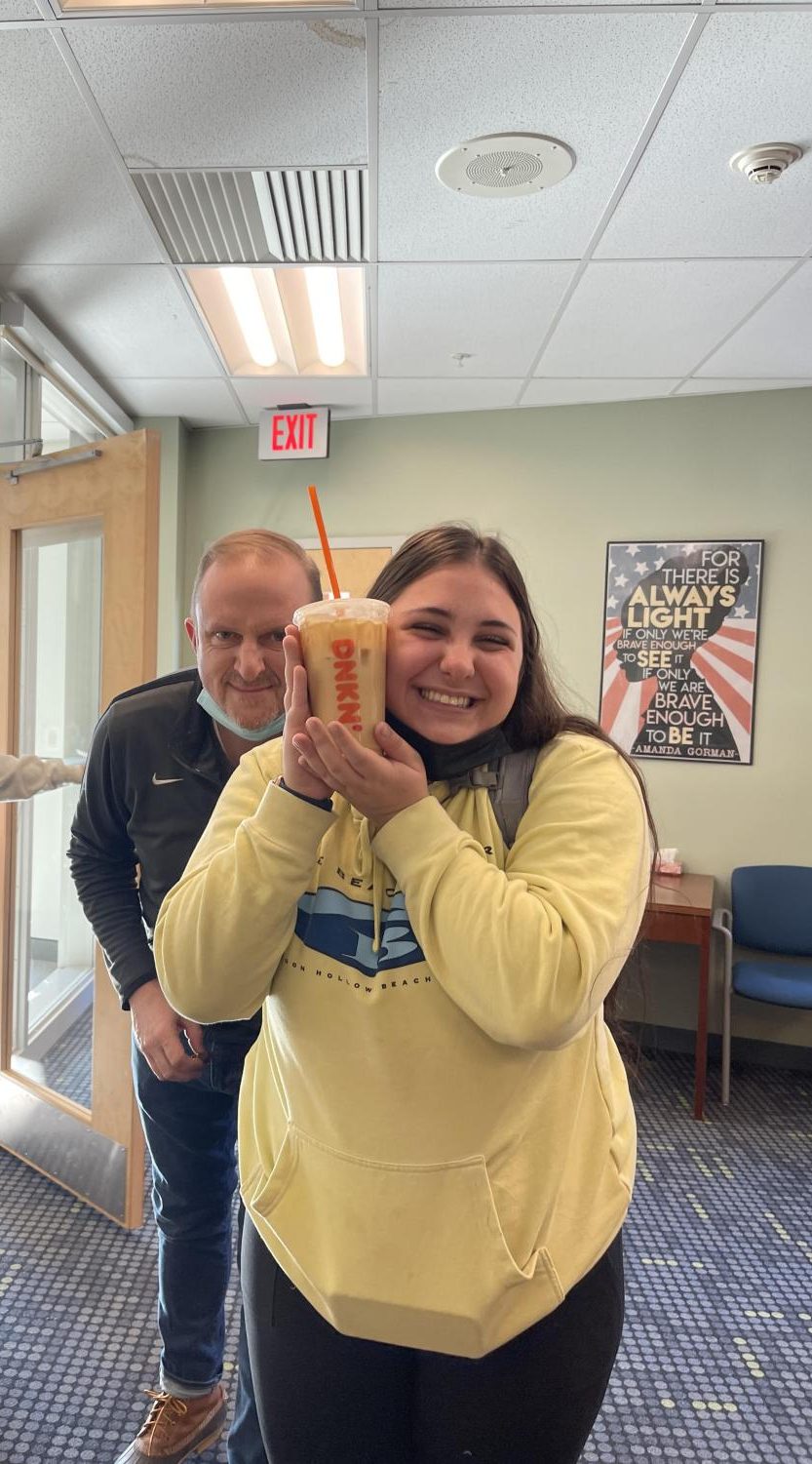 Leah Joseph is all smiles with her Dunkin iced coffee. Mr. McCarthy... not so much. 