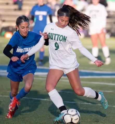 Sarah Mendoza keeps the Monson player away from the ball during the championship game. 