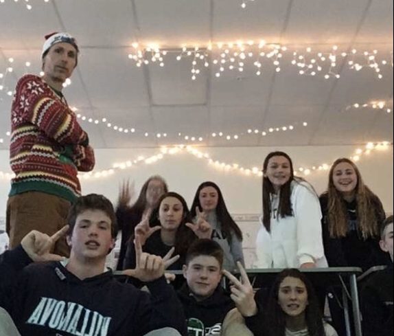 Students in English class demonstrate their holiday spirit under the lights