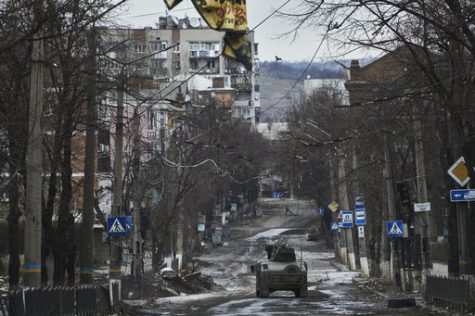 A lone Ukrainian Humvee rides into the ravaged frontline city Bakhmut, Ukraine.