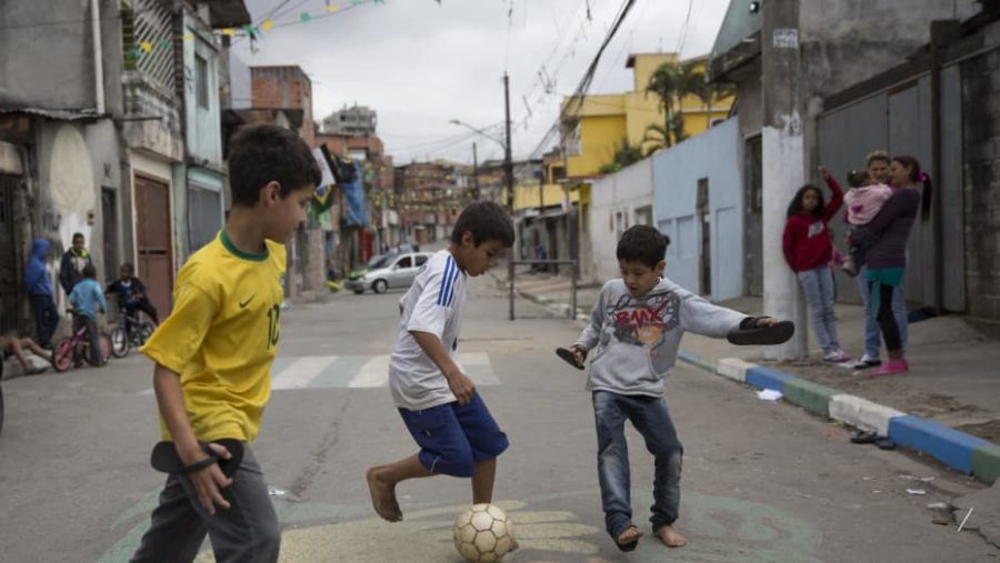 Children in Brazil always play in the street and have fun. 