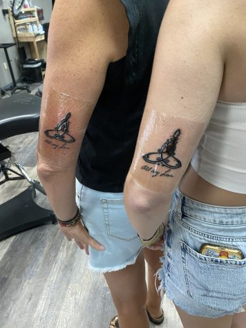 My mom and I showing off our seconds old tattoos in celebration of my 17th birthday. 