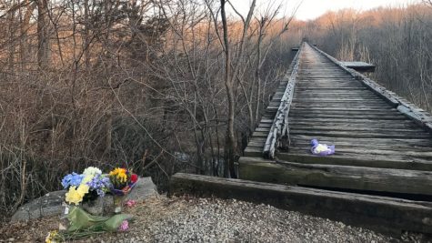Flowers next to Monon bridge in memory of Liberty German and Abigail Williams 