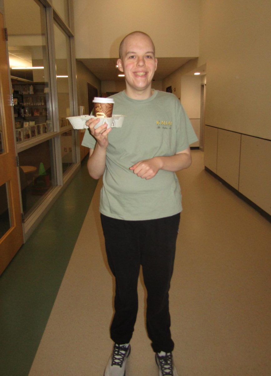 Every morning, Zach makes coffee deliveries. His smile is just an added bonus!