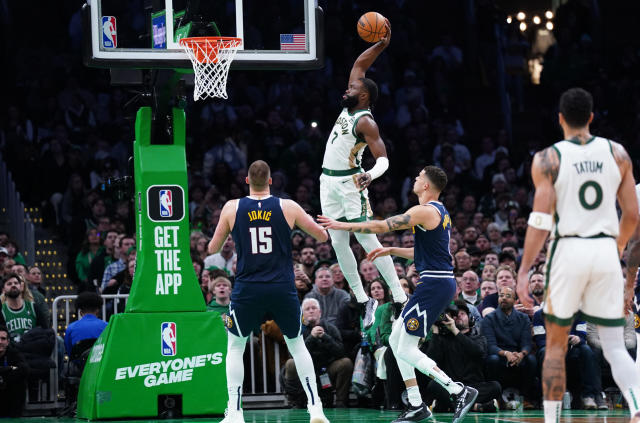 Jaylen Brown driving in for a one handed dunk
