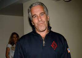 Epstein posing for a picture in his home