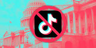 The icon for TikTok metaphorically blocked by the shadow of Congress. 
