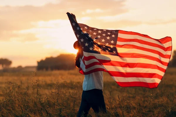 U.S.A. Flag waving during the sunset.
(Allegiance Flag Supply)