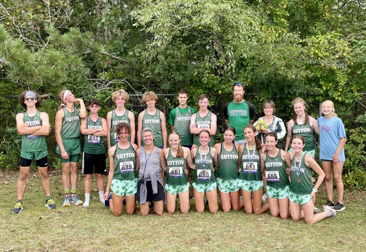 After a successful first race, the team poses for a happy photo.