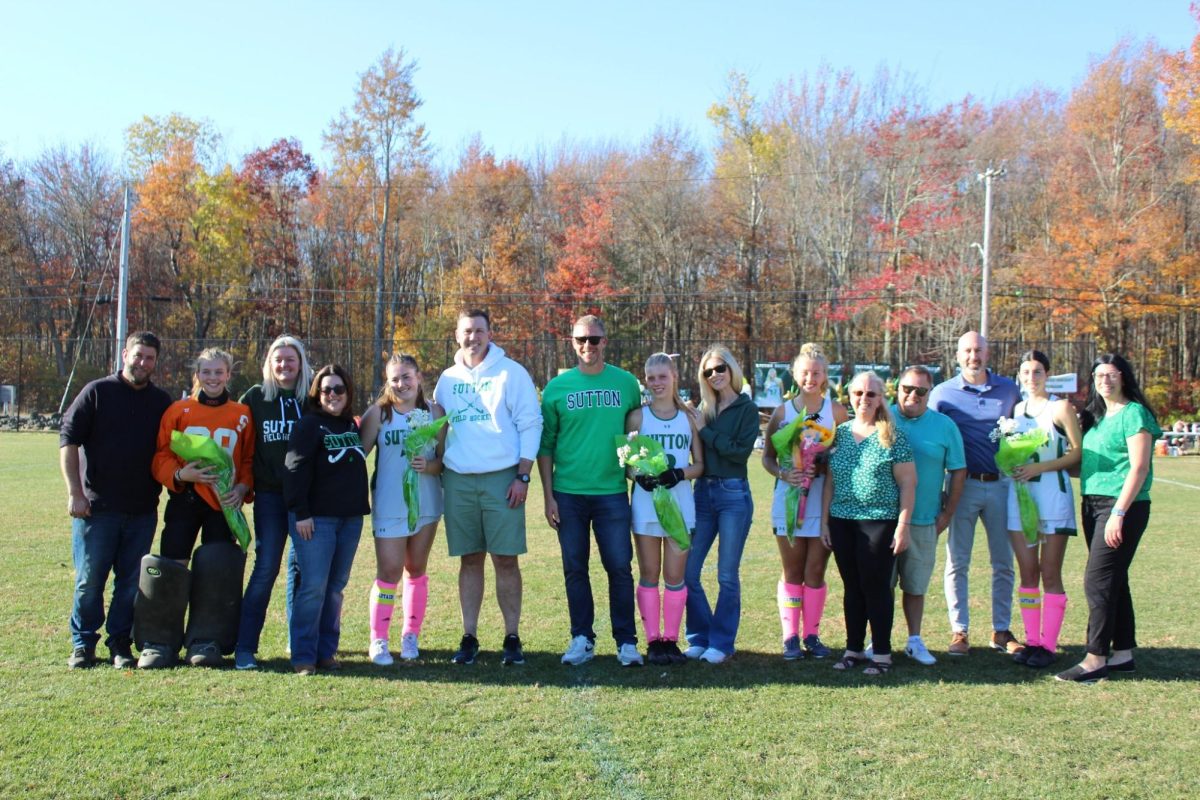 The seniors and their parents celebrate their years of playing before the game. 