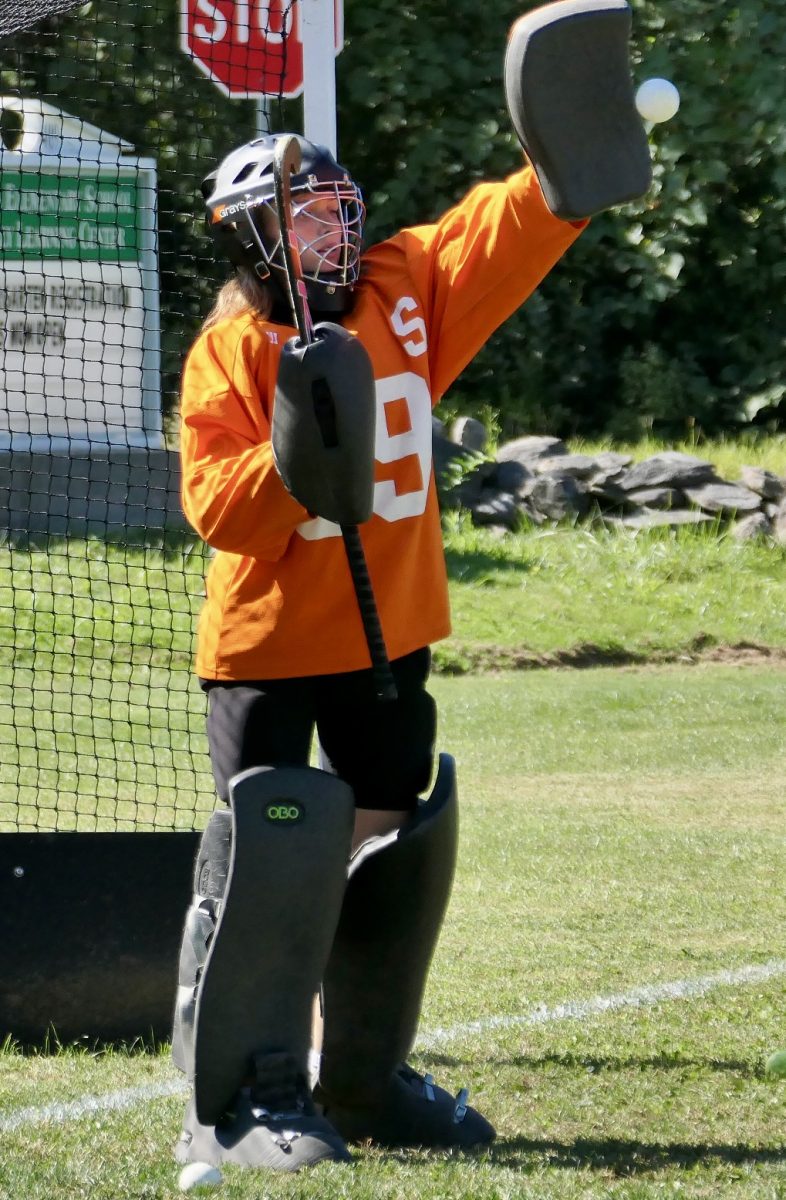 Here goalkeeper, Allie Hastings blocks a shot.