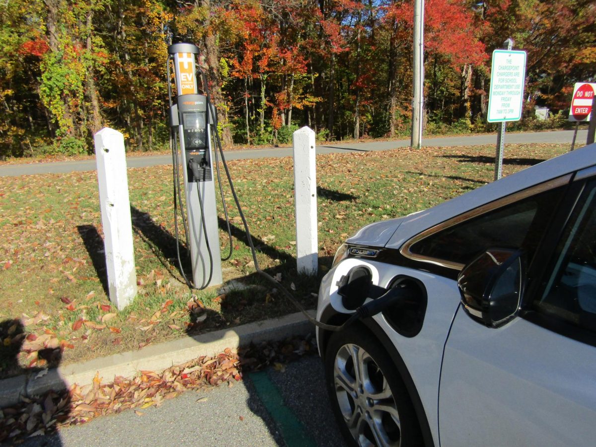 An electric car using the plug in stations in the Sutton Middle/High School parking lot