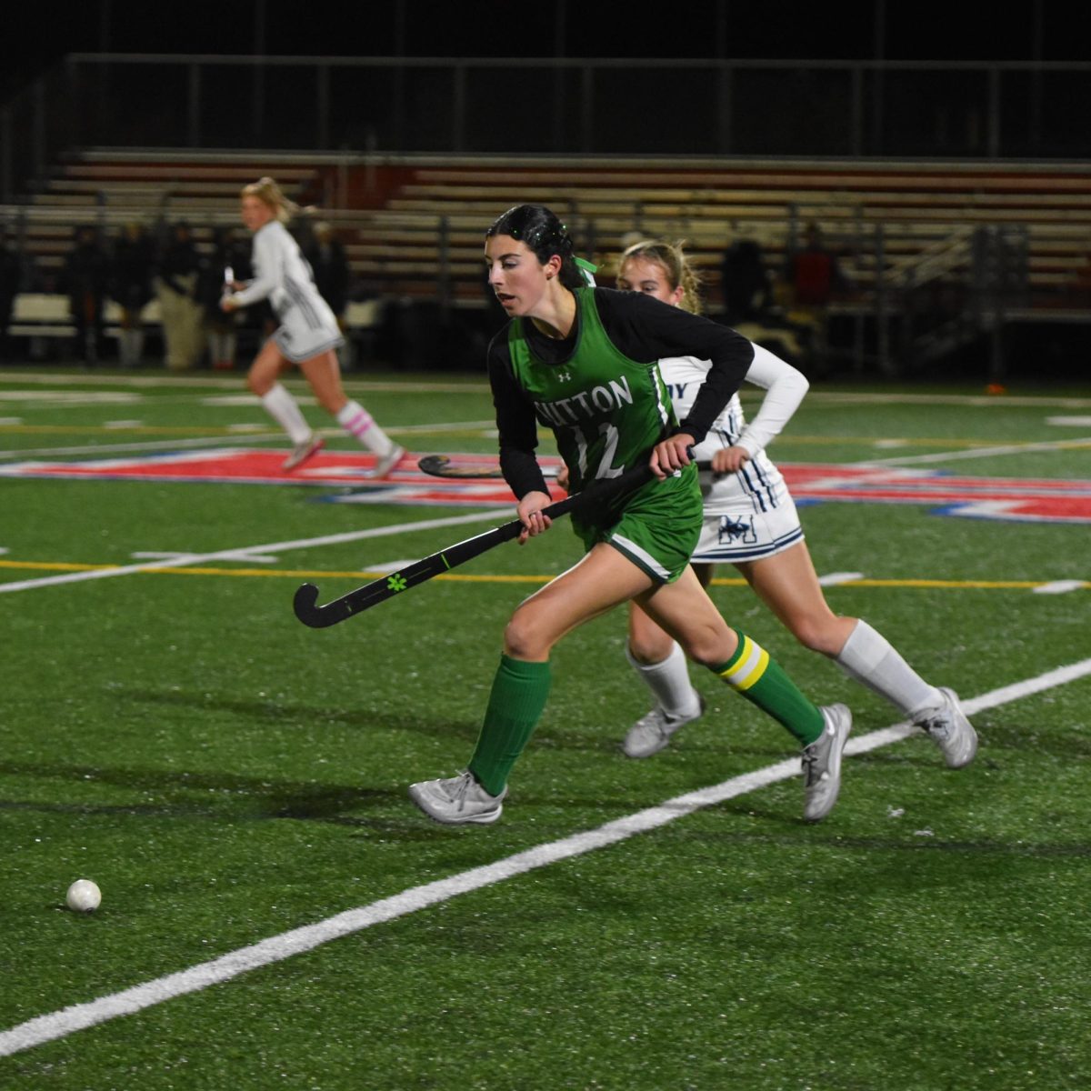 Kat Quill tracks to ball down in hopes of soring against Monomoy last evening.