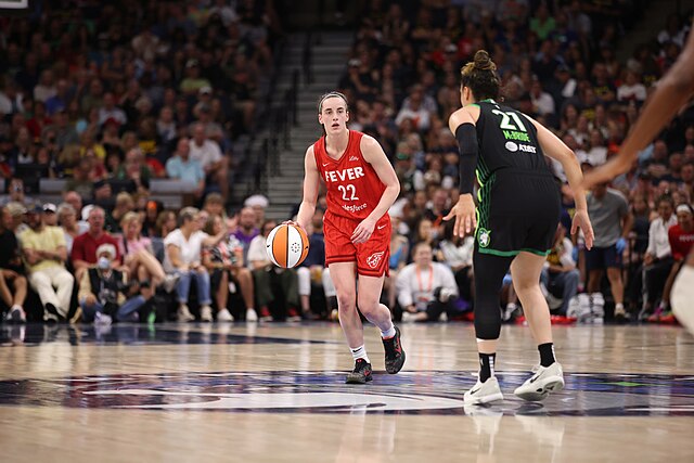 In her first year, Caitlyn Clark helped boost attendance in the WNBA. (Johnmac--Public Domain--https://en.m.wikipedia.org/wiki/File:Caitlin_Clark_Fever.jpg)