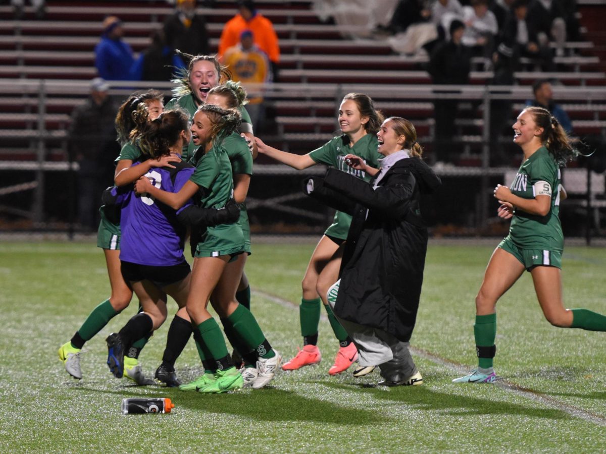 The Suzies celebrate after another win that puts them one win away from a fourth straight state title. 