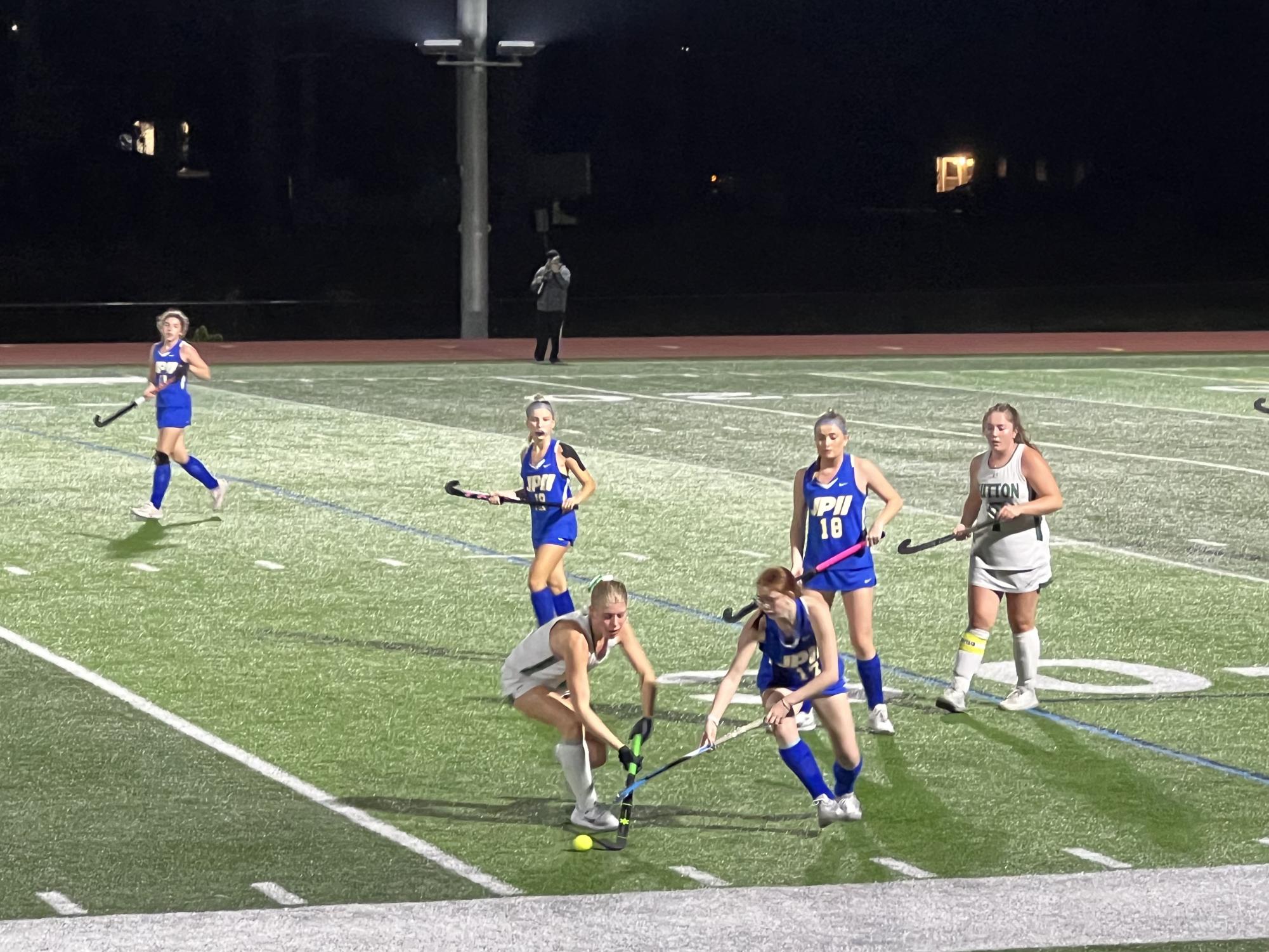 Field hockey player Karolina Eykman gets the ball back from the opposing team in the last quarter.