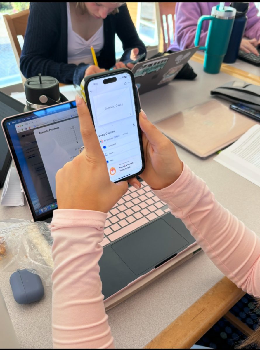 Student using their cell phone to study on Quizlet for an upcoming test. 