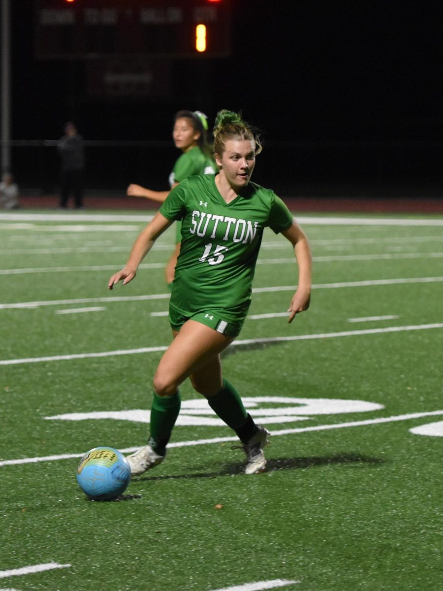 Molly Jenkins looks to push the ball up field