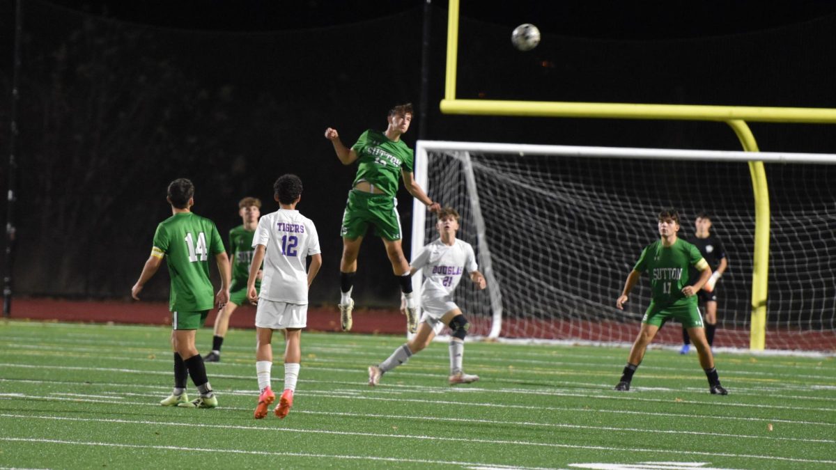 Paul leaps for a header during last night's game against Douglas.