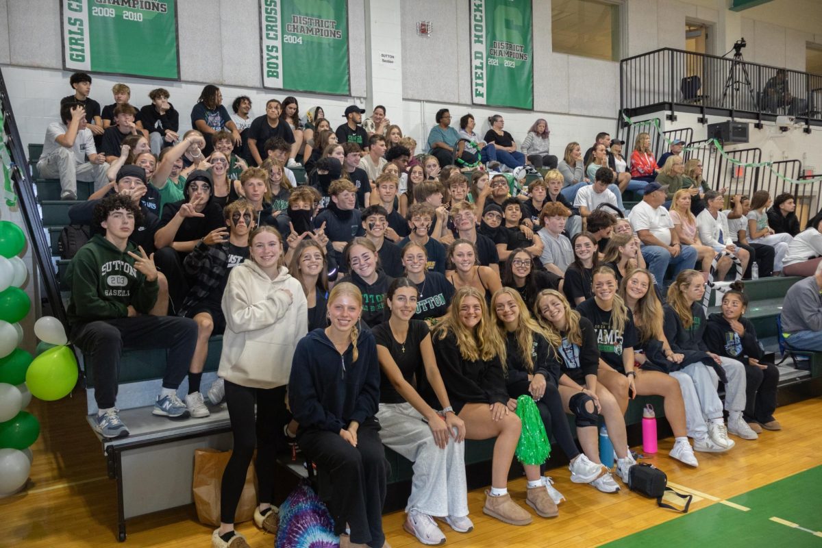 Sutton High School fan section supporting varsity volleyball on senior night