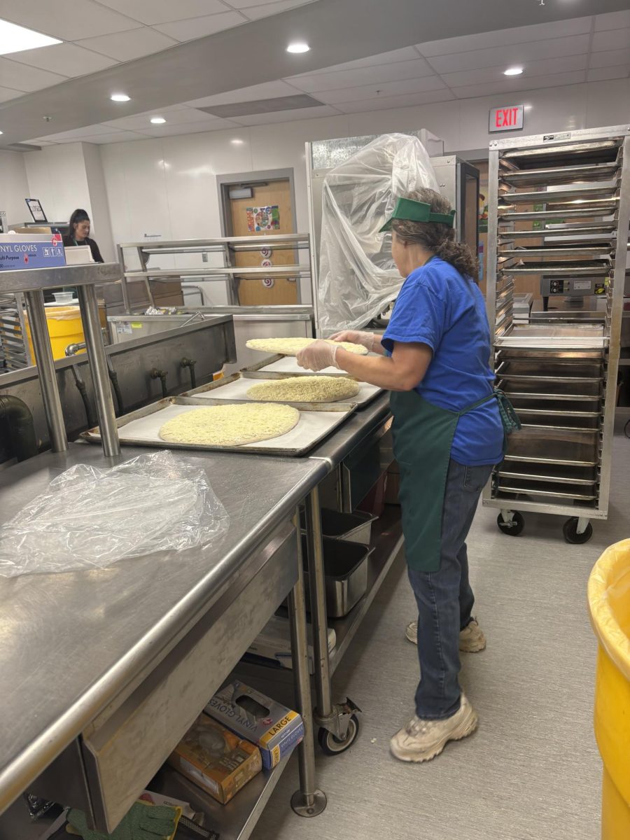 Sutton High's very own, super special lunch crew preparing a yummy pizza lunch.