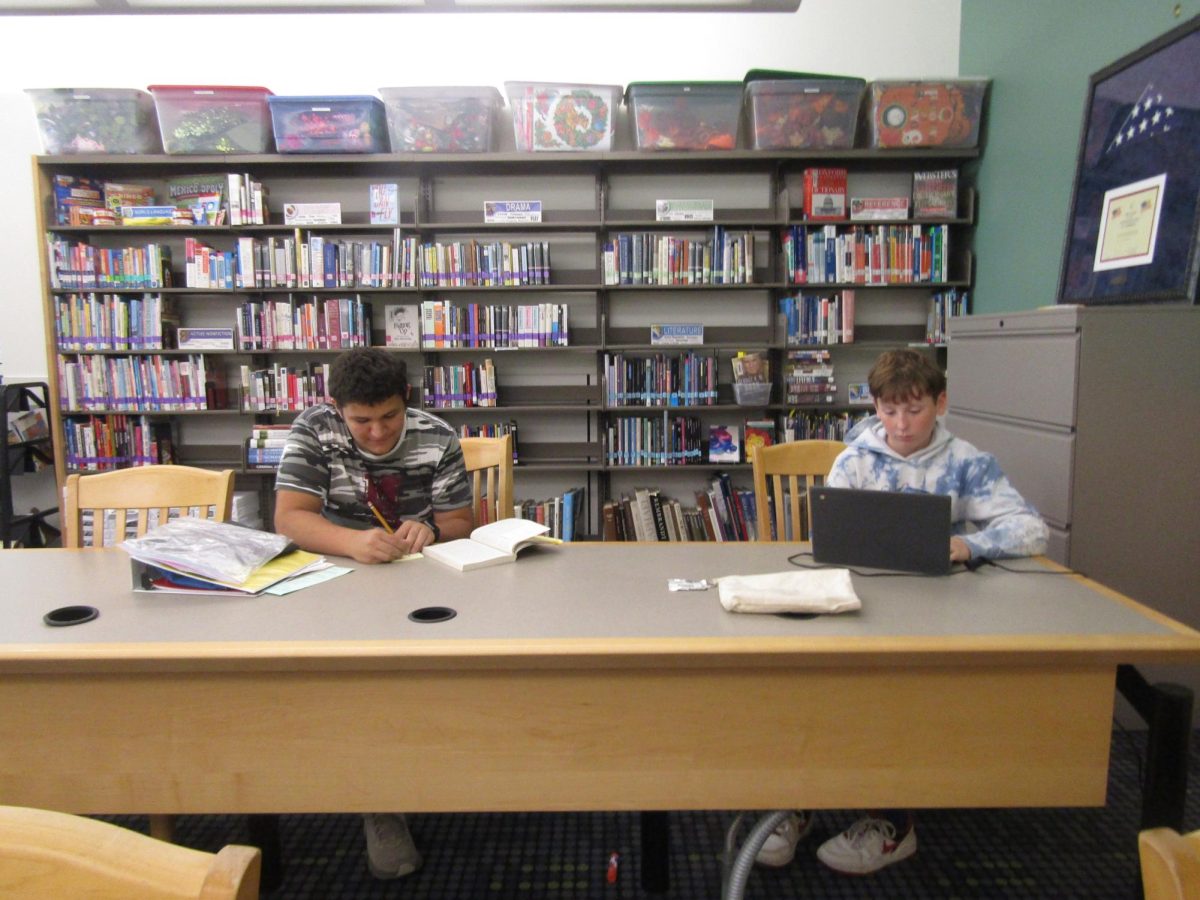 Two periods are reserved for a class taught by Mrs. Farmer. With no librarian assistant, no one else is allowed in the library so Mrs. Farmer can dedicate herself to the class.
