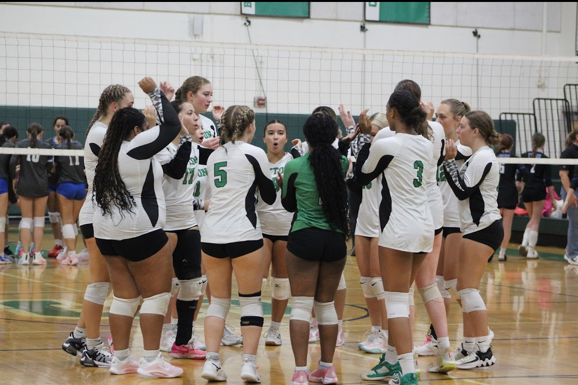 The girls team cheers before one of their games