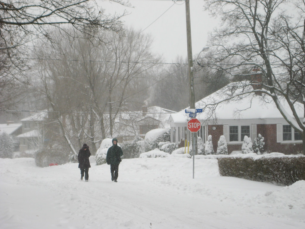 Two people walk in the winter, but is this always safe during a snowstorm?