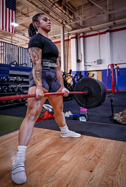 Senior Airman Bianca Mendoza, 377th Security Forces Group defender, deadlifts at Kirtland Air Force Base, N.M., Dec. 15, 2023. Mendoza holds the New Mexico state powerlifting record for her age bracket and is aiming to compete in the nationals. (U.S. Air Force photo by Senior Airman Ruben Garibay)